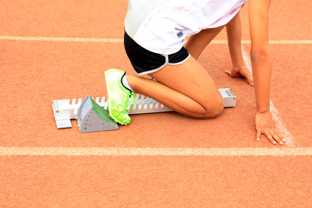 istock the athlete sprint start, The sprinters are at the starting line 1353385444