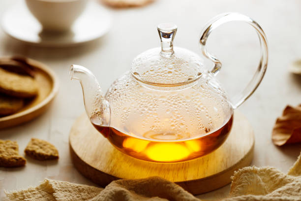 istock hot glass teapot with teabag. 1353385474