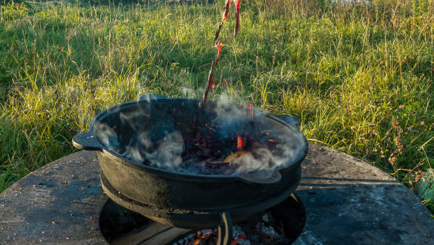 istock Mulled wine in a large cauldron. Mulled wine is cooked in a large pot. Vitamins in the traditional festival. 1353385846