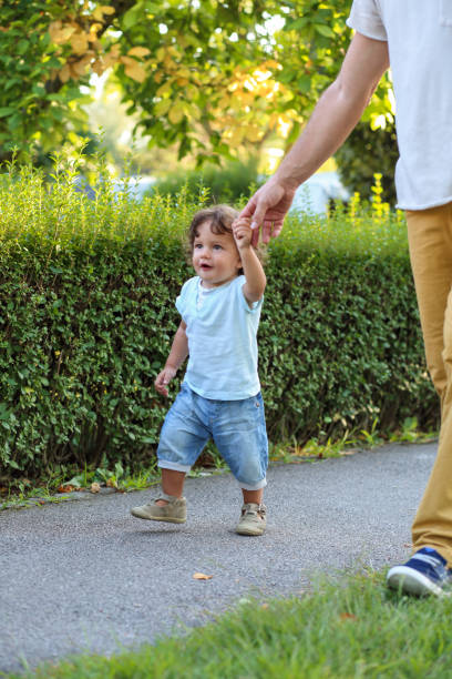 istock Young family on a walk 1353386620