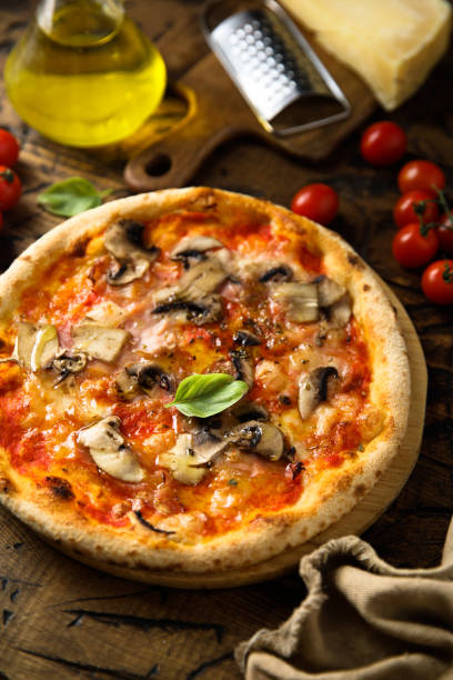 istock Pizza with mushroom and ham 1353386748