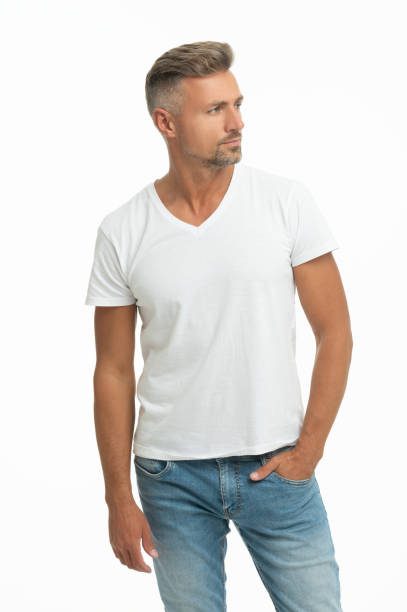 istock This is what handsome look like. Handsome guy in white tshirt. Caucasian man keep hand in pocket 1353388447