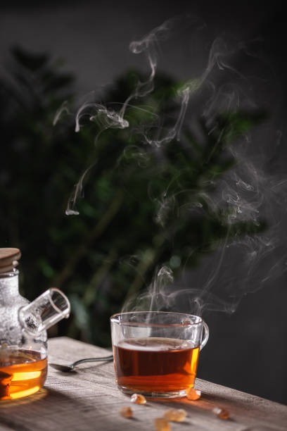 istock Cup of hot tea with sugar lollipops 1353388545
