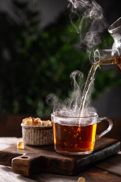 istock Cup of hot tea with sugar lollipops 1353388580