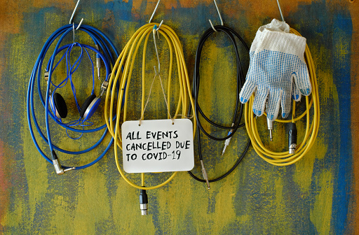 cancellation of cultural events due Covdi-19 lockdown, cables,headphone and cancellation note, symbol picture