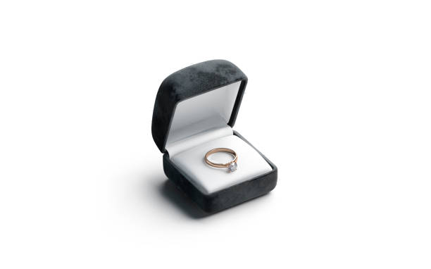 istock Blank black box with gold diamond ring lying mockup, isolated 1353391331