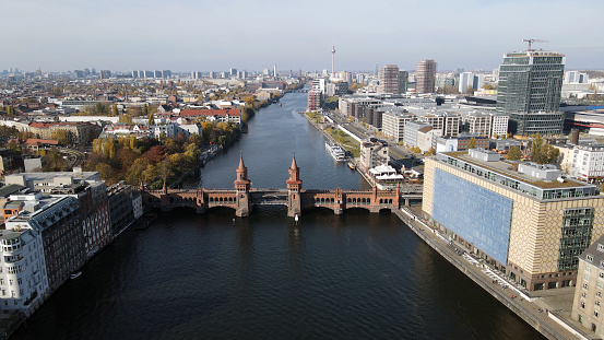 Drone point of view of the famous Oberbaumbruecke Bridge in Berlin city center in a sunny day in Autumn