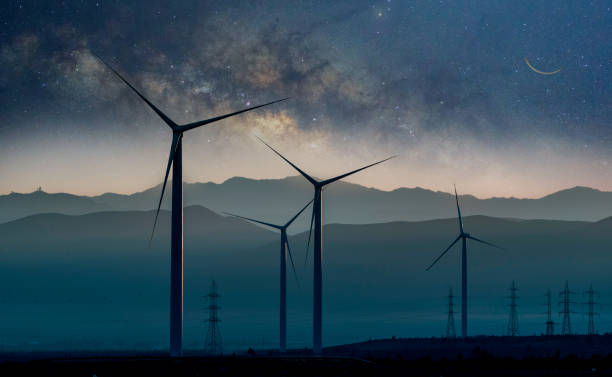 windkraftanlagen in der wüste von atacama bei nacht mit milchstraßenhintergrund - industry dusk night sustainable resources stock-fotos und bilder