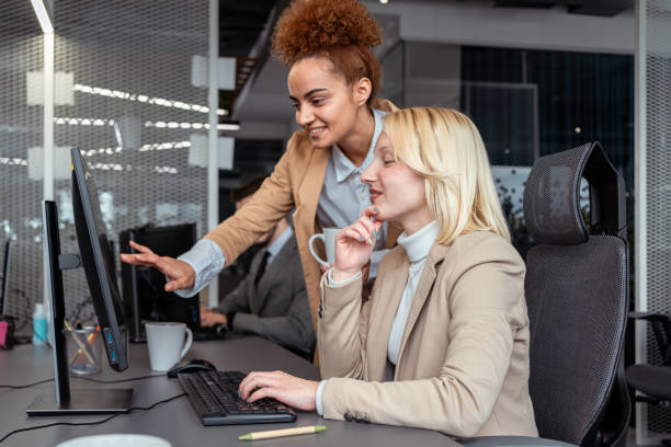 istock Modern multiracial businesswomen, checking the data on the computer, from the office 1353397426