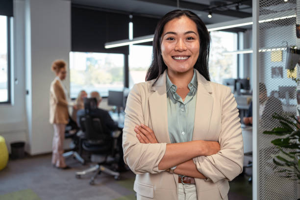 Portrait of an confident businesswoman, Asian ethnicity  with arms crossed stock photo