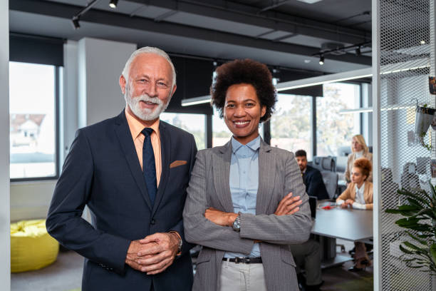 istock Successful and modern multiracial coworkers with arms crossed 1353397644
