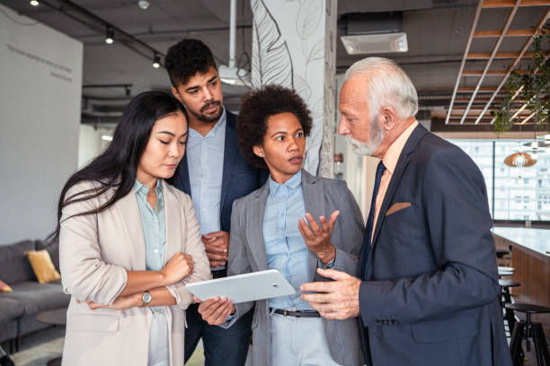 istock Worred and dedicated multiracial business team, trying to solve a work problem togehter 1353399216