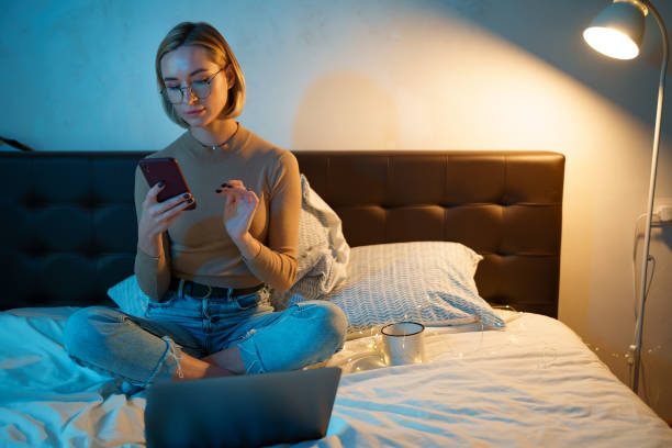 istock Woman in glasses checking social apps and working. 1353399453