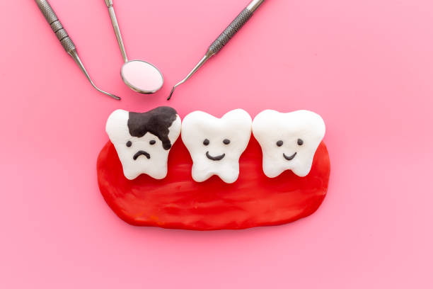 istock Oral health and care concept with teeth models with dentist tools 1353399606