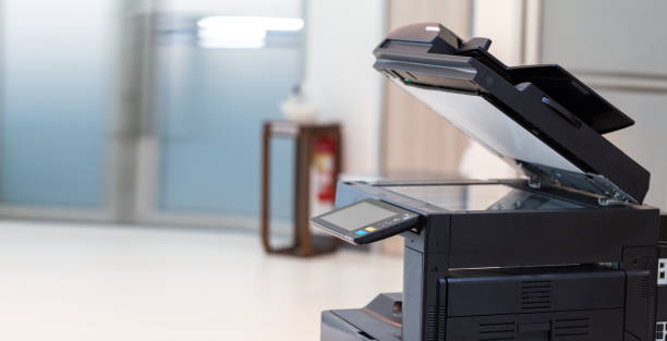 istock photocopier or network printer is office worker tool equipment for scanning and copy paper. 1353400567
