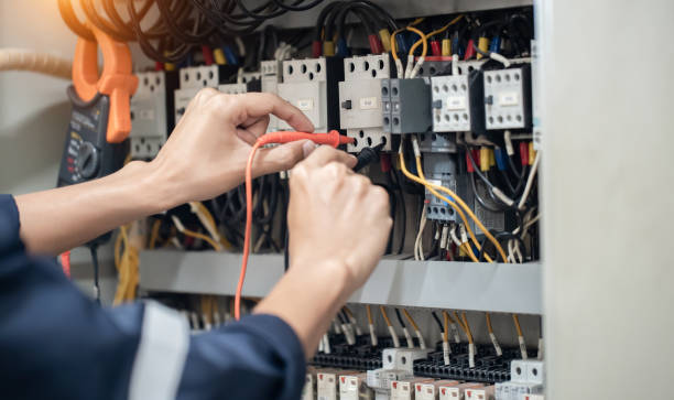 istock Electrician engineer work tester measuring voltage and current of power electric line in electrical cabinet control , concept check the operation of the electrical system . 1353400653