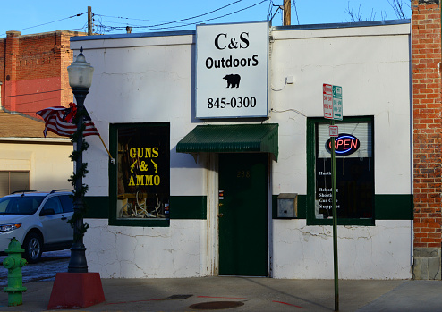 Trinidad, Las Animas County, Colorado, USA: gun store facade with American flag - C&S Outdoors, guns and ammunition shop