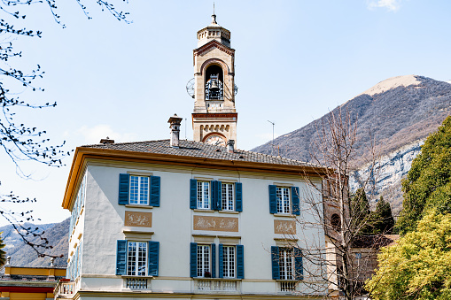 Church of San Lorenzo against the backdrop of mountains. Lake Como, Italy. High quality photo