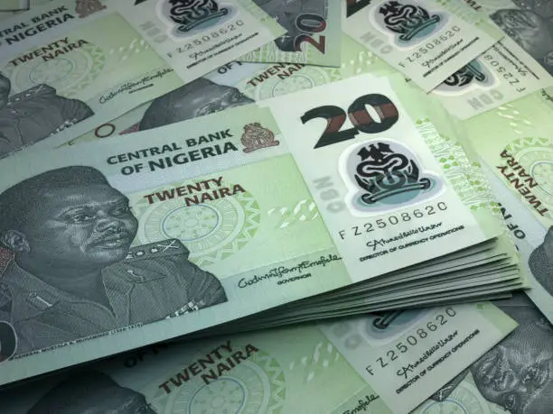 Money of Nigeria. Nigerian naira bills. NGN banknotes. 20 polymer. Business, finance, news background.