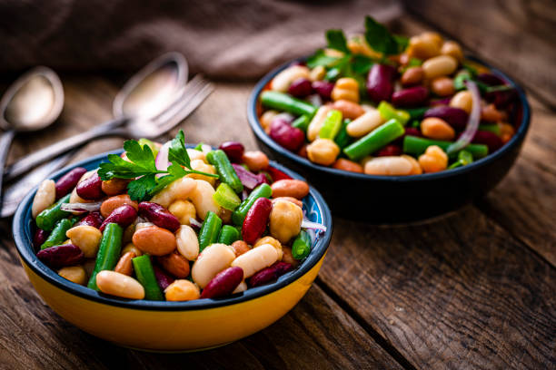 istock Two fresh healthy bean salad bowls on rustic table 1353402207