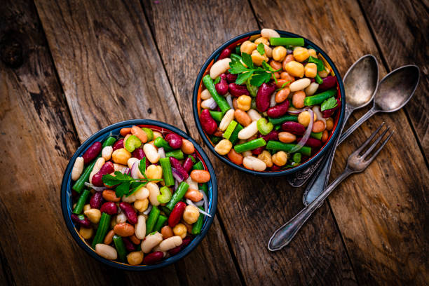 istock Top view of two bean salad bowls on rustic table 1353402833