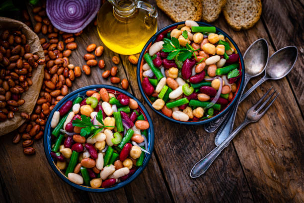 istock Top view of two bean salad bowls with ingredients 1353402838