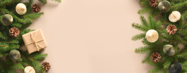 istock Christmas craft eco gift and festive composition with pine cones on beige background. 1353403640