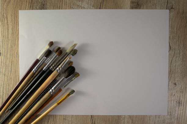 istock Watercolor brushes on a light background. Concept for art education, art class or studio and art therapy. 1353404619