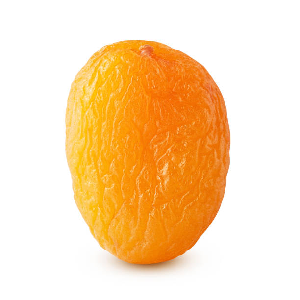 istock Dried apricot close-up isolated on a white background 1353404904