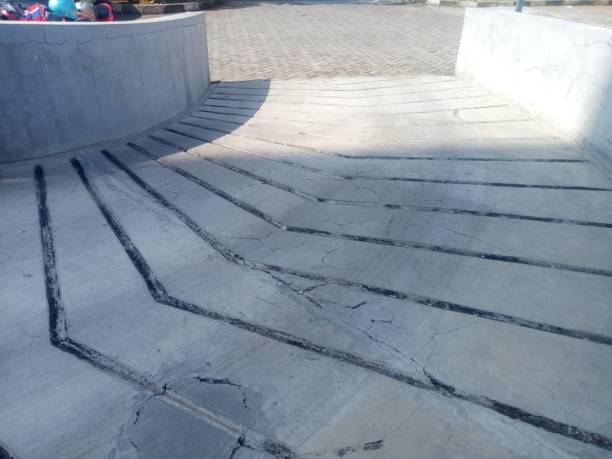 istock concrete road with water flow photo 1353406483