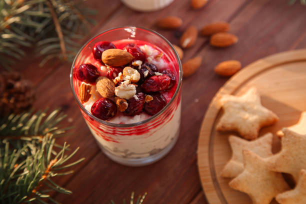istock Christmas rice pudding with almonds and cherries on wooden background. Risalamande 1353407538