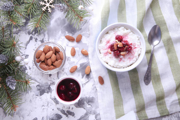 istock Christmas rice pudding with almonds and cherries on a light background. Risalamande 1353408260