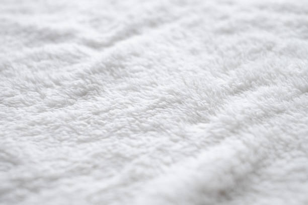 Background of white plush fabric. stock photo