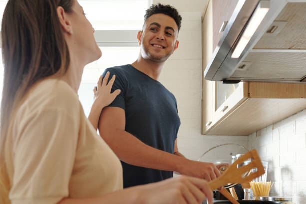 istock Couple Enjoying Cooking Together 1353408673