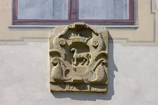 Sucha Beskidzka, Poland -  August 7, 2021 :Stone relief coat of arms on the wall of 16th century renaissance Sucha Beskidzka castle also called Little Wawel