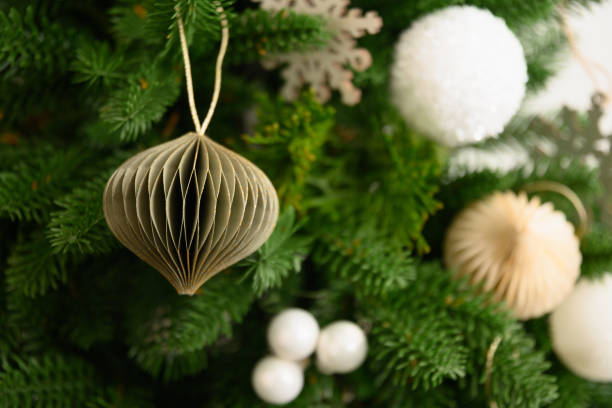 istock Green paper Diy decor on Christmas tree. 1353410978