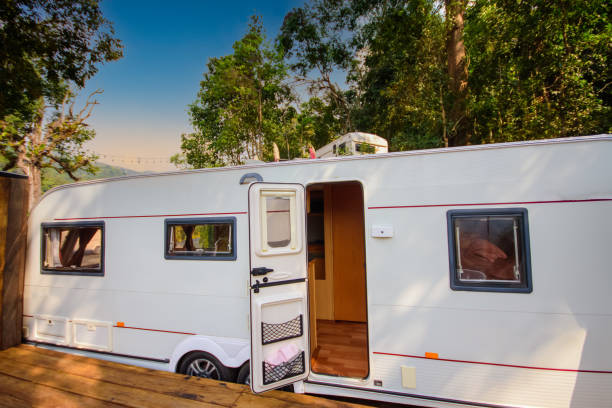 istock Camping car on a grassy campground 1353412157