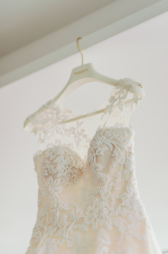 Elegant lace dress. Wedding dress on a a hanger
