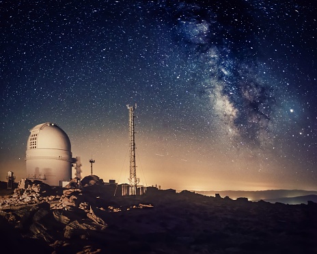 astronomical observatory dome investigating the milky way on a starry night