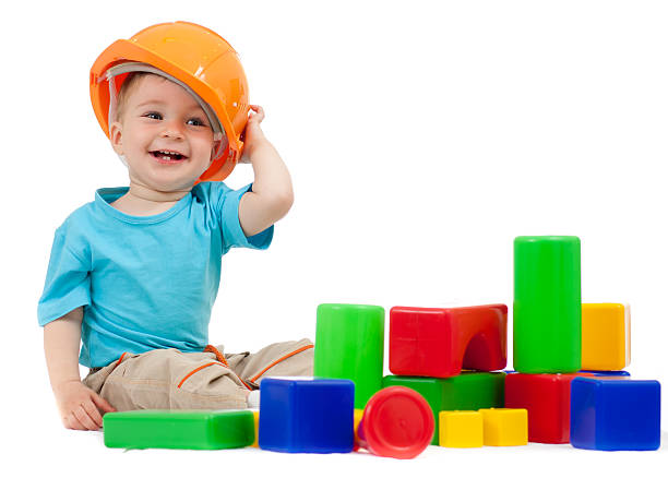 istock little boy with hard hat playing building blocks 135341393