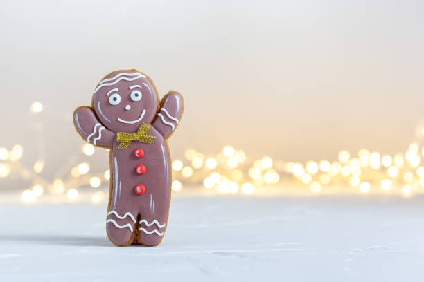 istock Christmas Gingerbread man on festive light background. 1353414573