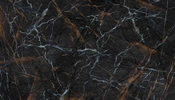 istock Abstract background with artificial stone texture. Black marble imitation with white and gold veins. Creative wallpaper 1353415346