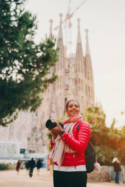 istock Tourist woman with camera exploring Bracelona 1353417164