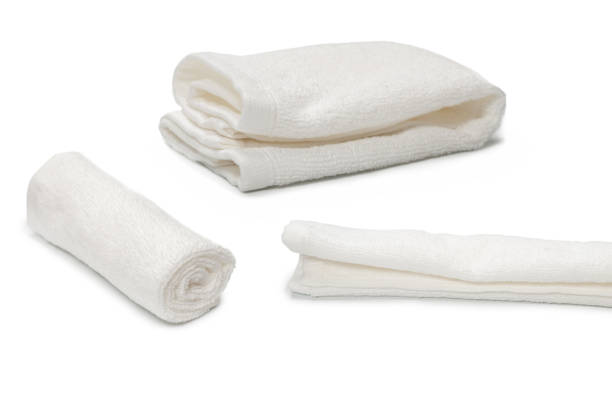 istock White fluffy cotton towel isolated on a white background. 1353417287