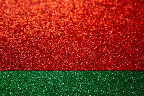 istock Shiny abstract green background with red stripes. Christmas glitter background 1353418955