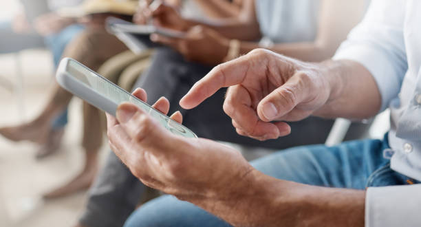 istock Shot of an unrecognizable businessperson using a phone at work 1353419704