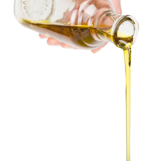 istock Oil pouring from a bottle. 1353420891