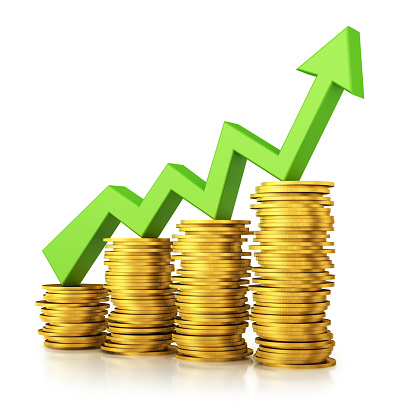 Stacks of golden money coin and green grow up arrow . Business chart graph on the white background. Finance and investment concept.