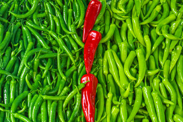 Red and green chili peppers. Fresh vegetable background. Full Frame
