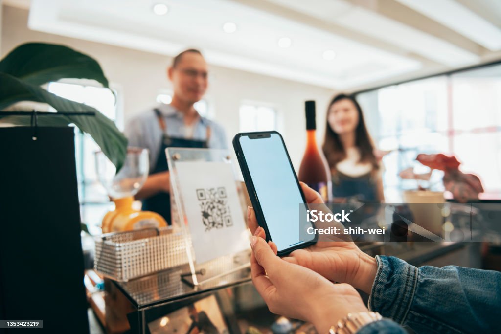 payment for paying by smartphone - NFC technology QR Code Stock Photo